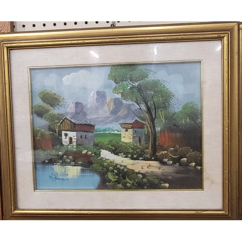 131 - An oil on board depicting two houses at the foot of a mountain. Indistinguishably signed. 45 x 55cm ... 