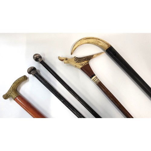 143 - Five walking sticks.