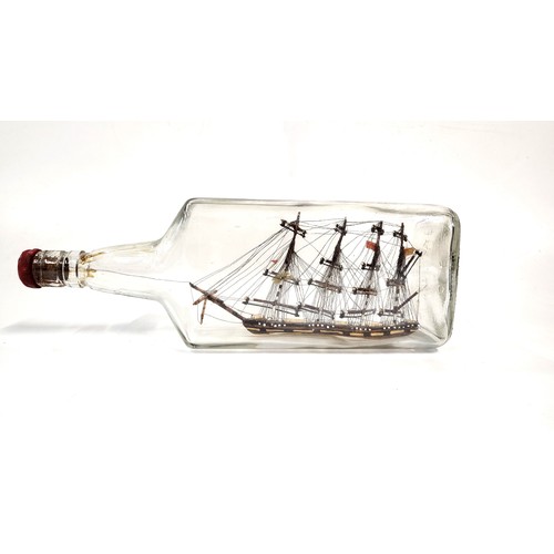 150 - A four masted ship in a glass bottle