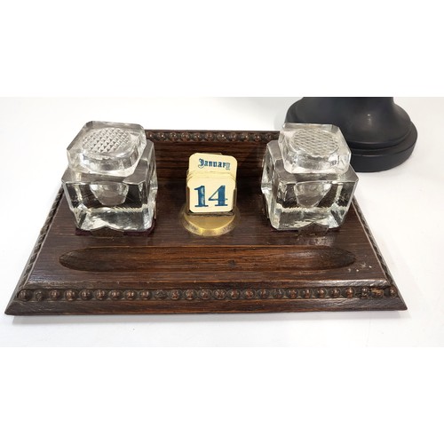 170 - A perpetual desk calendar and ink stand 25.5cm wide, and a bust of Winston Churchill 33cm high. (2)