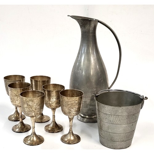 179 - A collection of various metalware including an Indonesian pewter bucket and ewer and six silver plat... 