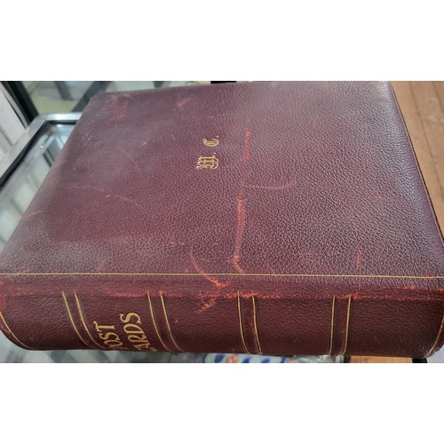 191 - An Art Nouveau leather bound postcard album containing approx. 230 postcards from the 1920's era.