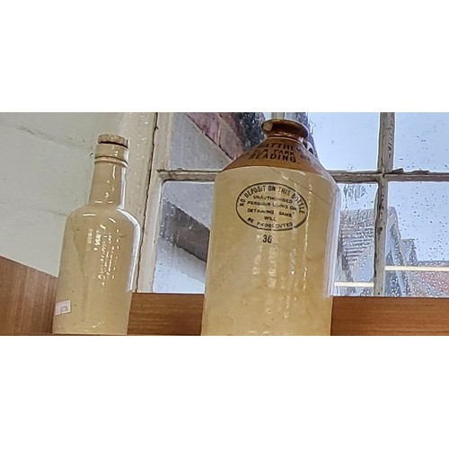 218 - Twenty-five items of stoneware bottles and jars. Largest 28cm. (25)