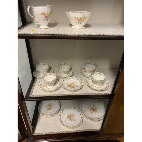 221 - A Melba part tea service with six cups and saucers, and a Foley part tea service with five cups and ... 