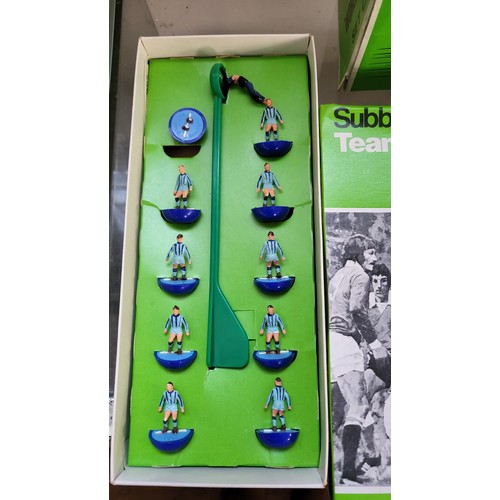 157 - Subbuteo OO scale football figures in boxes, components, three pitch cloths, and 1978 catalogue.