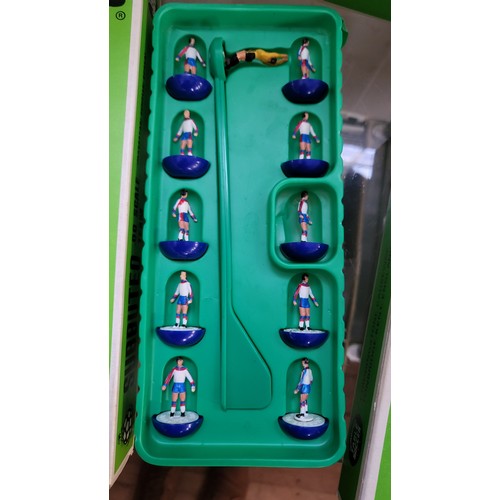 157 - Subbuteo OO scale football figures in boxes, components, three pitch cloths, and 1978 catalogue.