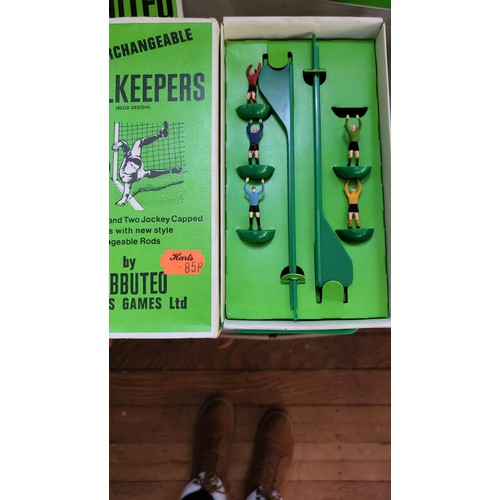 157 - Subbuteo OO scale football figures in boxes, components, three pitch cloths, and 1978 catalogue.