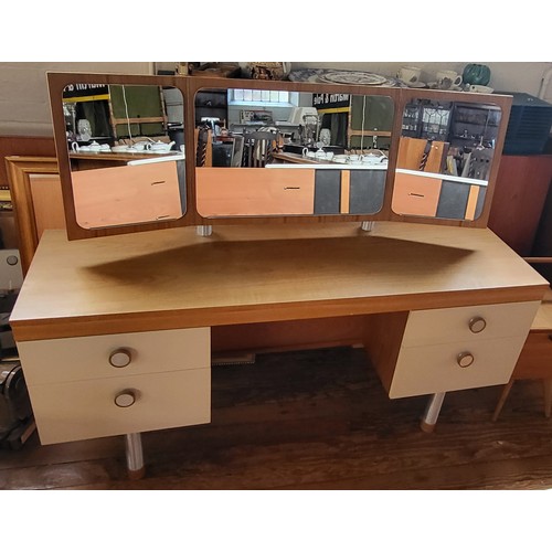 4 - A mid-century dressing table with triple vanity mirror, off-white/ cream drawer fronts, and standing... 