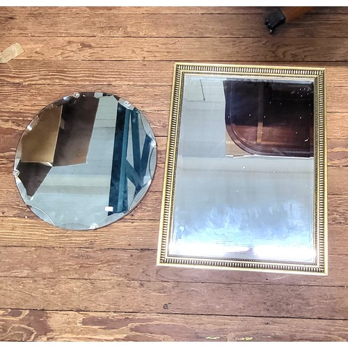 31 - A round bevelled edge mirror 45cm diameter, and a rectangular mirror with gilt frame 55 x 50cm. (2)