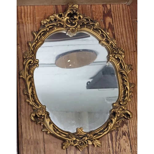 35 - Vintage Rococo style oval mirror with gilt gesso frame. H: 66cm W: 48cm