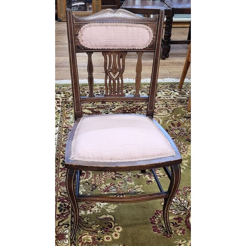 68 - An Edwardian inlaid chair with pink upholstery on the back rest and seat. 79cm.