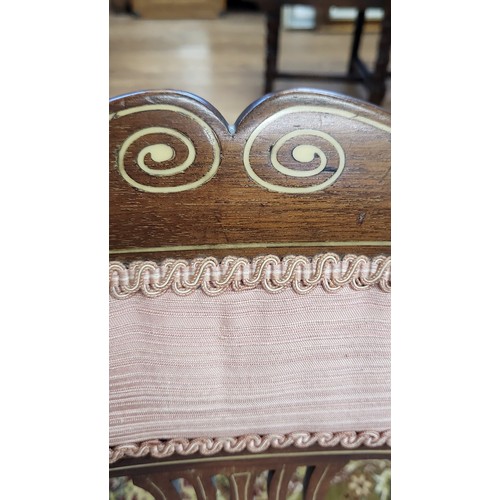 68 - An Edwardian inlaid chair with pink upholstery on the back rest and seat. 79cm.