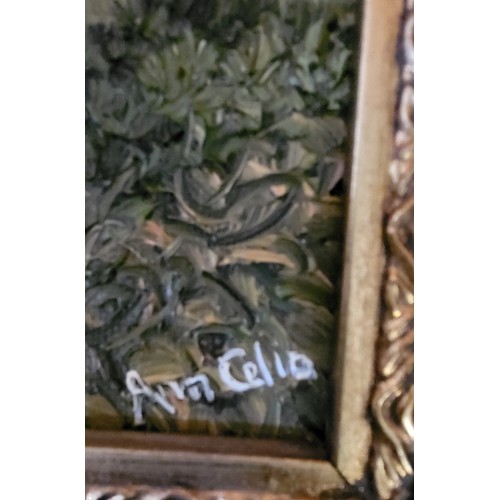 80 - Three works of art in ornate gilt gesso frames including an oil on board of a path leading to a cott... 