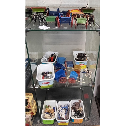 180 - Britains and other makers hollow-cast figures, horses, carts and milk churns (some pieces slightly p... 