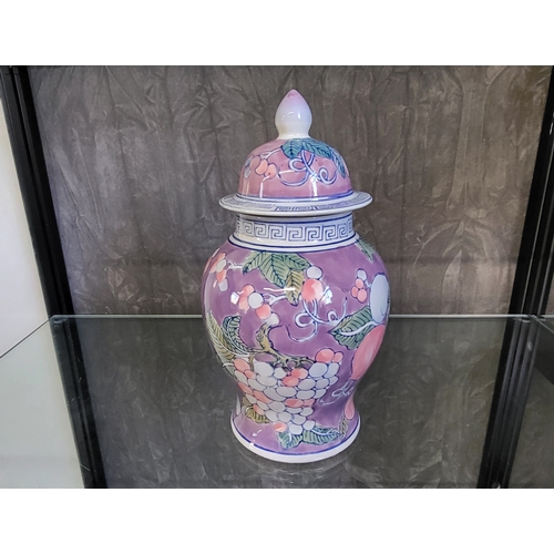 251 - A Chinese porcelain baluster vase and cover, the lavender-ground with pomegranates and grapes decora... 