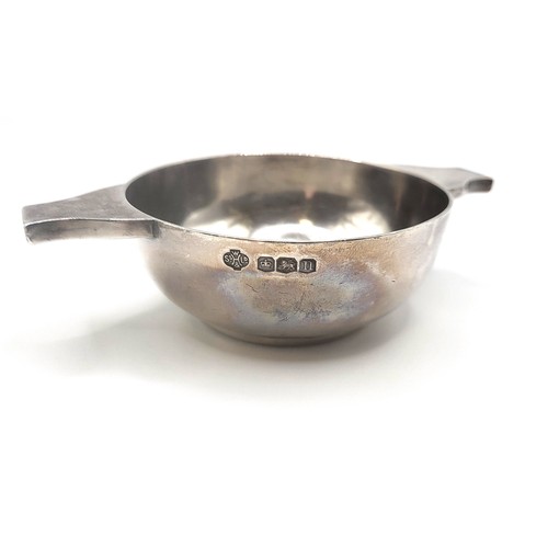 343 - A silver quaich William Hutton & Sons Ltd, Sheffield 1930 2.5cm height, 10cm width 64.1gms, and a si... 
