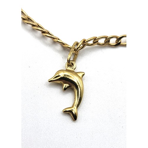365 - A 9ct yellow gold  curb link chain anklet with a bolt ring clasp and a dolphin charm. 1.1gms.