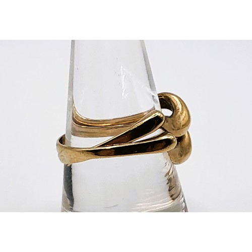 370 - A 9ct yellow gold puzzle ring 4.5gms size Q 1/2.