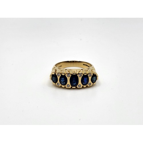 392 - An 18ct yellow gold Victorian style setting sapphire and diamond set ring. With five graduated oval ... 