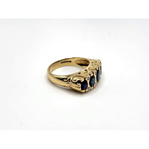 392 - An 18ct yellow gold Victorian style setting sapphire and diamond set ring. With five graduated oval ... 