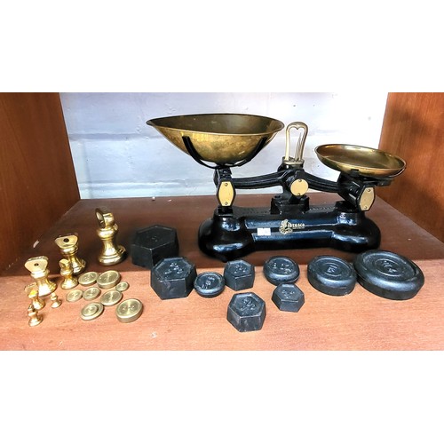 Libra scales and two sets of weights.