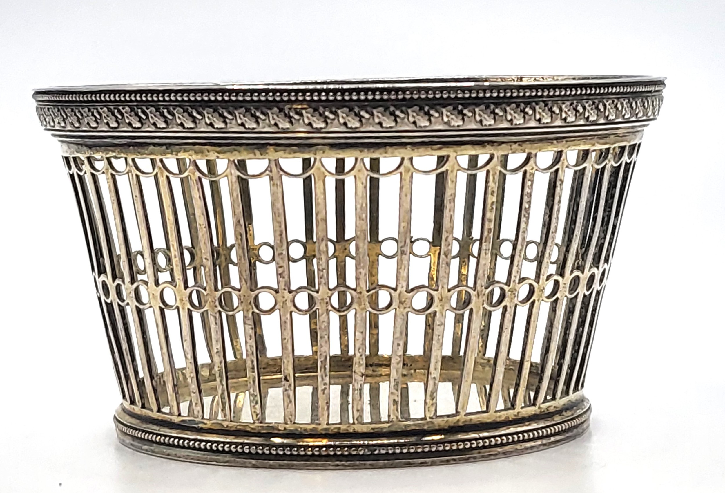 A decorative bonbon dish featuring delicate pierced openwork by ...