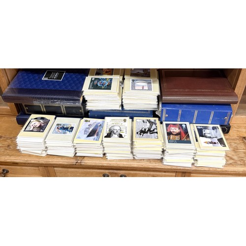 A large quantity of first day covers, postcards, and oversized postage ...