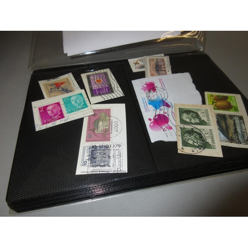 54 - Album containing a collection of approximately five hundred World postage stamps