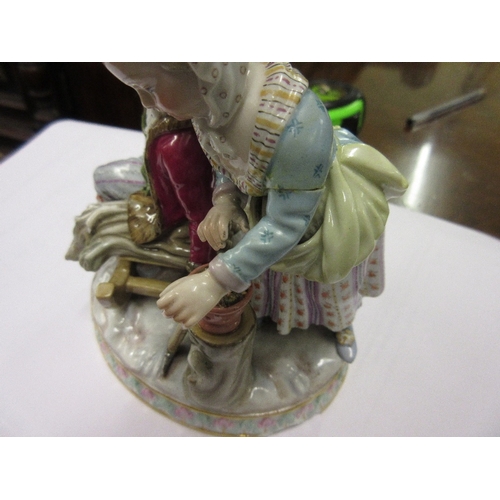 598 - 19th Century Meissen group of a seated woodman and wife on an oval base (with damages)