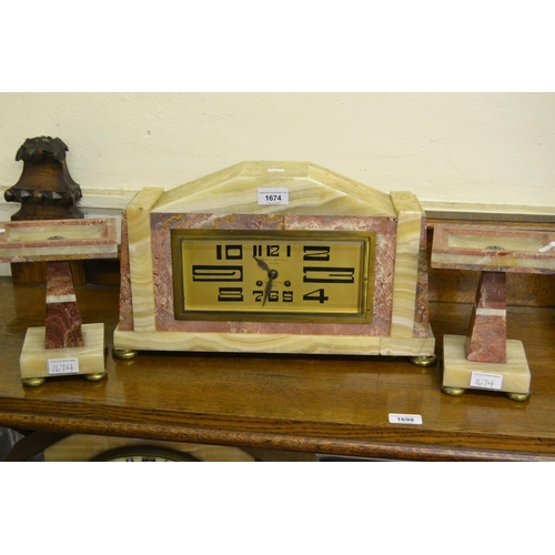 1674 - Art Deco beige and pink marble three piece clock garniture, the large rectangular signed Comptoir Ge... 