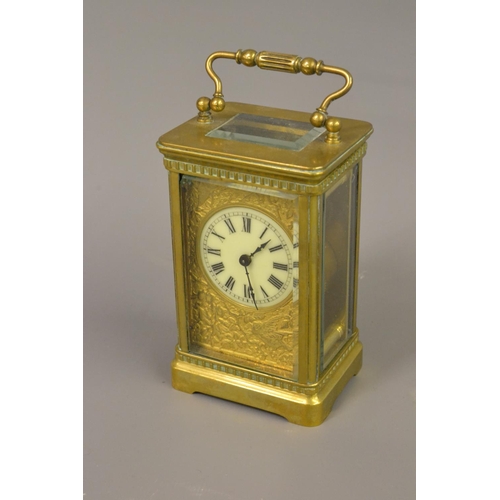 1696 - Edwardian gilt brass carriage clock, the circular dial with Roman numerals and ornate cast gilt bras... 