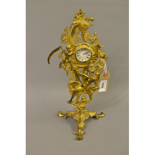 1699 - 19th Century gilt brass mantel timepiece cast with figures with later replacement movement