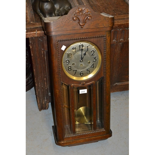 1717 - Early 20th Century oak cased wall clock with a silvered dial, Arabic numerals and three train moveme... 