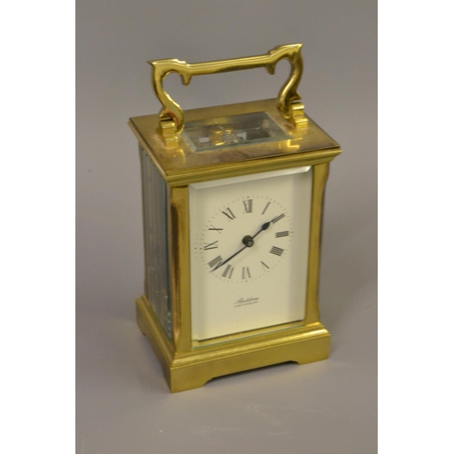 1724 - 20th Century brass cased carriage clock with key, the dial inscribed ' Sladdens, Canterbury '