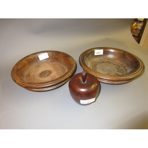 2291 - Two antique treenware coasters, one with a replacement base insert, together with a small treenware ... 