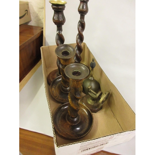 67 - Two pairs of 1930's wooden candlesticks, a nutcracker in the form of a ships wheel and a brass bell