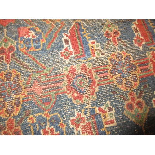 5 - Kurdish rug of all-over floral design with multiple borders on a wine ground, approximately 6ft x 4f... 