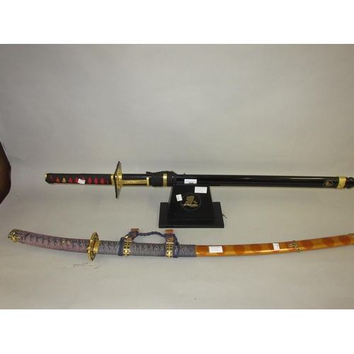 204 - Two replica Samurai Katana with scabbards