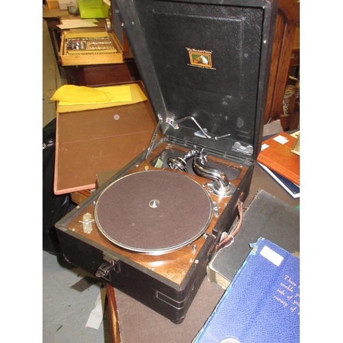 206 - 20th Century rexine cased H.M.V. wind-up table model gramophone, together with a small quantity of 7... 