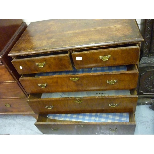 2357 - Early 18th Century walnut chest, the crossbanded and moulded top above two short and three long draw... 