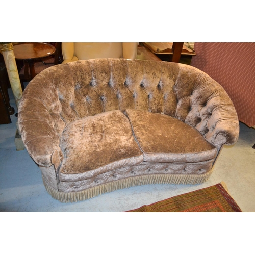 2365 - Newly upholstered kidney shaped two seat sofa with a buttoned grey velvet type upholstery