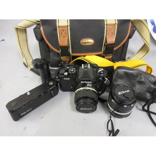 408 - Nikon FM2N 35mm camera outfit with motor drive and three lenses, 35mm F2, 85mm F2 and 24mm 2.8 wide ... 