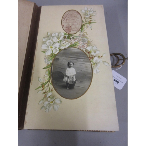 409 - Victorian leather bound photograph album with floral decorated pages