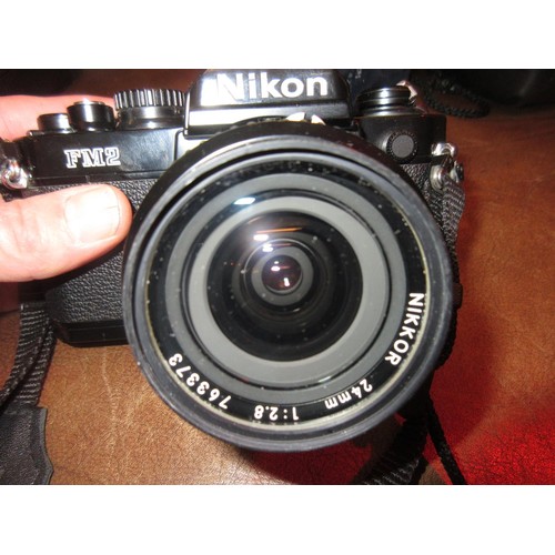 408 - Nikon FM2N 35mm camera outfit with motor drive and three lenses, 35mm F2, 85mm F2 and 24mm 2.8 wide ... 