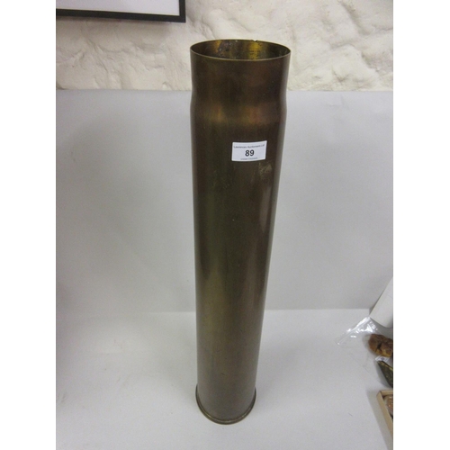 Large brass artillery shell case