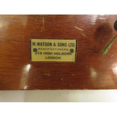 196 - Mahogany and brass plate camera by W. Watson and Sons Ltd., together with three separate plates