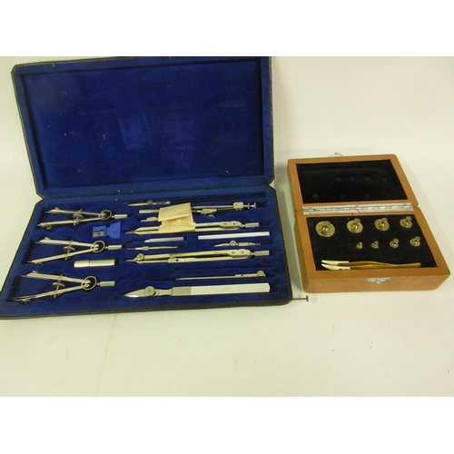 201 - Cased set of drawing instruments and a cased set of brass balance scale weights