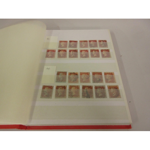 230 - Red stock book containing a quantity of Penny Red stamps