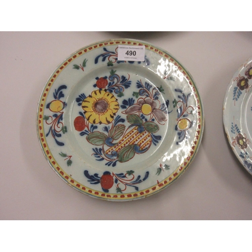 490 - Three 18th Century English Delft plates (damages), together with a similar Continental Delft plate, ... 