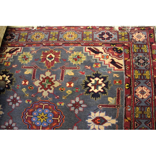 5 - Mid to late 20th Century Belouch rug with a medallion and all-over stylised flower head design on a ... 